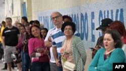 People queue to vote during the municipal elections runoff in Sao Paulo, Brazil, on Oct. 27, 2024.