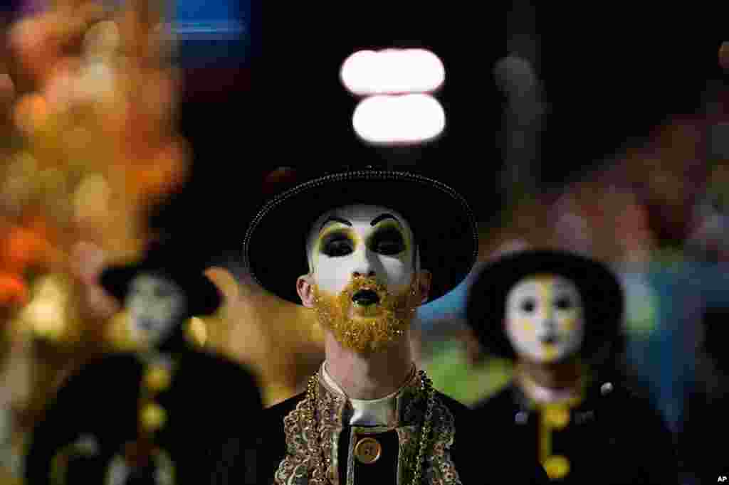 A performer from the Sao Clemente samba school parades during carnival celebrations at the Sambadrome in Rio de Janeiro, Brazil, Feb. 24, 2020.