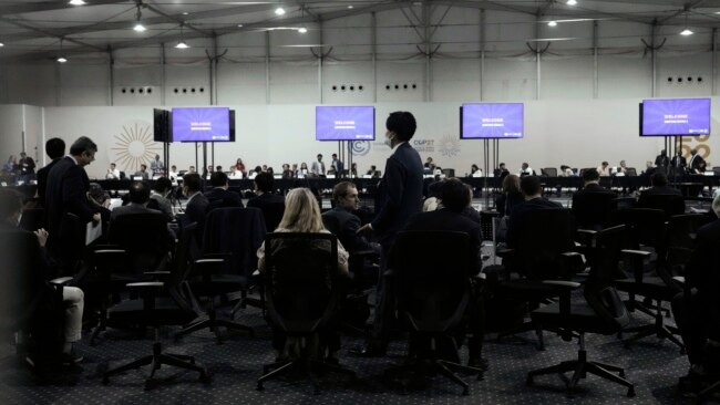Delegates gather for a meeting with the COP27 presidency that was closed to the press, at the U.N. Climate Summit, in Sharm el-Sheikh, Egypt, Nov. 19, 2022.