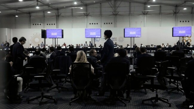 Delegates gather for a meeting with the COP27 presidency that was closed to the press, at the U.N. Climate Summit, in Sharm el-Sheikh, Egypt, Nov. 19, 2022.