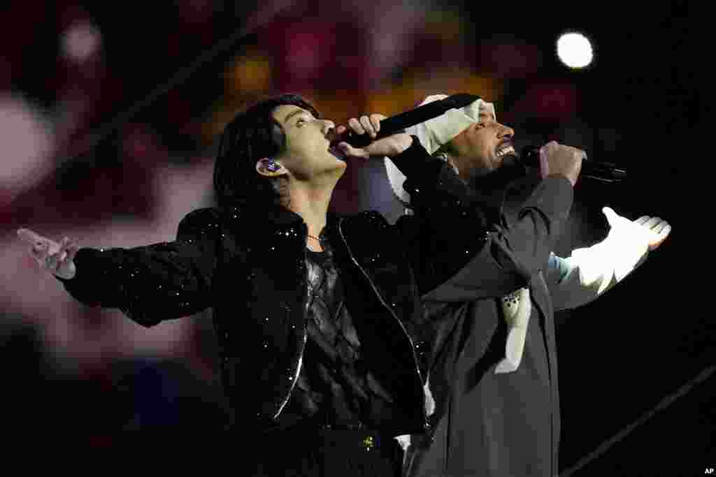 South Korean singer Jung Kook, left, and Qatari singer Fahad Al Kubaisi perform during the 2022 World Cup opening ceremony.