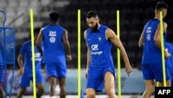 France's forward Karim Benzema (C) trains in Doha, Qatar, ahead of the 2022 World Cup football tournament. France's hopes of successfully defending the World Cup were dealt a blow Saturday when the Ballon d'Or winner was ruled out of the tournament because of an injury.