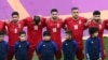 Iran players listen to the national anthem ahead of the Qatar 2022 World Cup Group B football match between England and Iran at the Khalifa International Stadium in Doha, Nov. 21, 2022. 