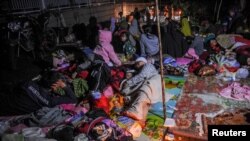 Locals are sheltered outside their houses after earthquake hit in Cianjur, West Java province, Indonesia, Nov. 21, 2022. (Antara Foto/Raisan Al Farisi/via Reuters)