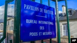 The entrance of the International Bureau of Weights and Measures is pictured in Sevres, outside Paris, Nov. 17, 2022. 