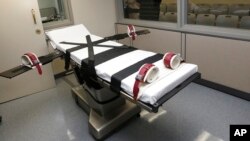 FILE - This photo shows the gurney in the execution chamber at the Oklahoma State Penitentiary in McAlester, Okla., on Oct. 9, 2014.