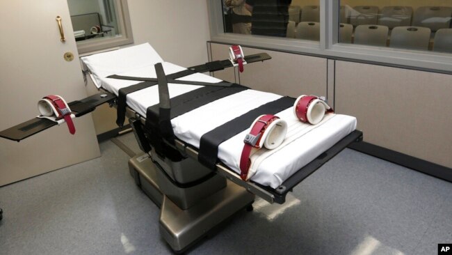 FILE - This photo shows the gurney in the execution chamber at the Oklahoma State Penitentiary in McAlester, Okla., on Oct. 9, 2014.
