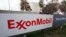 FILE - The sign for the Exxon Mobil Torrance Refinery in Torrance, California.