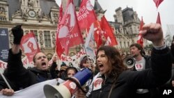 FILE: The May 1 protests follow earlier demonstrations at Paris town hall on Friday, April 14, 2023. The May 1 protests continue showing public anger at pension reforms that raise the full retirement age to 64.