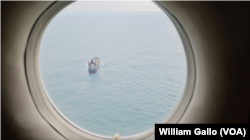 Ships as seen from a Canadian CP-140 military surveillance plane monitoring North Korea sanctions evasion in the East China Sea, Oct. 14, 2024.