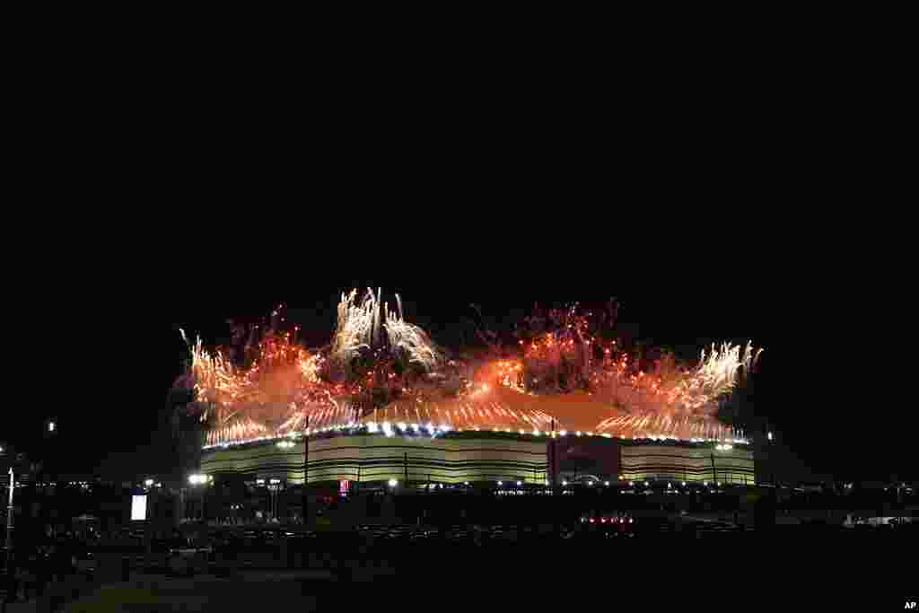 Fireworks explode over the Al Bayt Stadium before the start of the World Cup, group A soccer match between Qatar and Ecuador in Al Khor, Qatar.