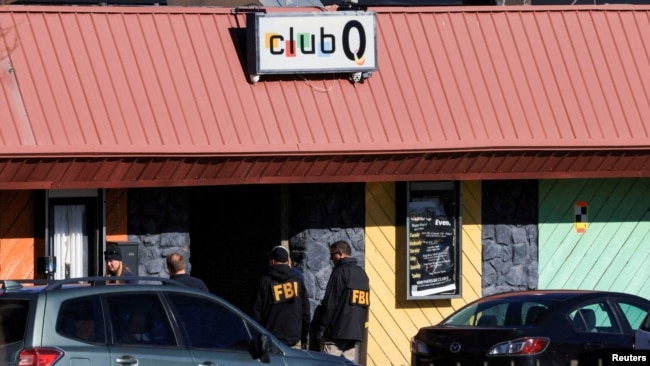 FBI agents stand outside the Club Q, an LGBTQ nightclub, the day after a mass shooting in Colorado Springs, Colo., Nov. 21, 2022.