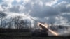 FILE - A Ukrainian BM-21 'Grad' multiple rocket launcher fires a rocket towards Russian positions on a front line in the Kharkiv region, Nov. 3, 2022, amid the Russia's invasion of Ukraine. 