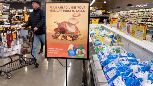 A man shops at a grocery store in Glenview, Illinois, Nov. 19, 2022. Americans are bracing for a costly Thanksgiving this year, with double-digit percent increases in the price of turkey, potatoes, stuffing, canned pumpkin and other staples.