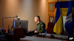 Mayor Vitali Klitschko works at his desk in his City Hall office in Kyiv, Nov. 18, 2022. Once a boxing champion, he is up against a challenge bigger than any he faced in the ring: Keeping Ukraine’s war-time capital functioning.