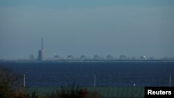 FILE - Reactors of the Zaporizhzhia Nuclear Power Plant, Europe's largest, are seen from the town of Nikopol, in Ukraine's Dnipropetrovsk region, Nov. 7, 2022, amid Russia's ongoing invasion of its neighbor.