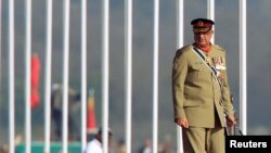 FILE - Pakistan's Army Chief of Staff General Qamar Javed Bajwa attends the Pakistan Day military parade in Islamabad, Pakistan, March 23, 2017. 