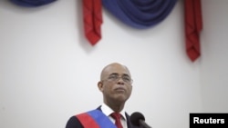 El entonces presidente saliente de Haití, Michel Martelly, habla en una ceremonia que marca el final de su mandato presidencial, en el Parlamento haitiano en Puerto Príncipr, Haití, el 7 de febrero de 2016.