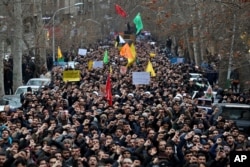 Protesters demonstrate over the U.S. airstrike in Iraq that killed Iranian Revolutionary Guard Gen. Qassem Soleimani in Tehran, Iran, Jan. 4, 2020.