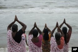 Indians offer tributes in remembrance of victims of the 2004 tsunami on the 20th anniversary of the tragedy, at Marina Beach in Chennai, Dec. 26, 2024.