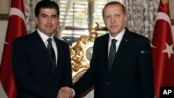 FILE - Turkey's President Recep Tayyip Erdogan, right, and Prime Minister of Iraq's autonomous Kurdish region Nechirvan Barzani shake hands before a meeting in Istanbul, Nov. 23, 2016. 