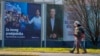 Pedestrians walk past campaign posters of presidential candidates Dragan Primorac and Zoran Milanovic ahead of the presidential election in Zagreb, Croatia, on Dec. 26, 2024.