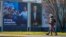 Pedestrians walk past campaign posters of presidential candidates Dragan Primorac and Zoran Milanovic ahead of the presidential election in Zagreb, Croatia, on Dec. 26, 2024.