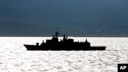 FILE - The Greek Navy frigate HS 'Spetsai' patrols in the Aegean Sea, off the Turkish coast, April 21, 2016.