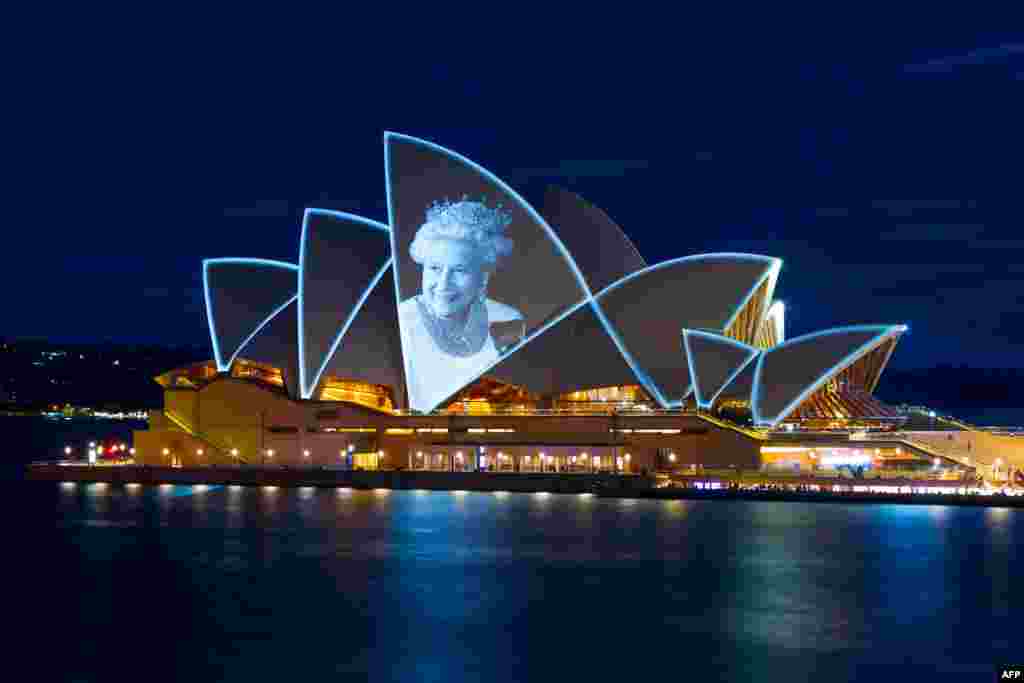 The sails of Australia&#39;s famous Opera House in Sydney are lit up with a picture of Britain&#39;s Queen Elizabeth II to honor her life.