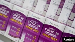 FILE - COVID-19 home test kits are pictured in a store window in the Manhattan borough of New York City, New York, Jan. 19, 2022. 