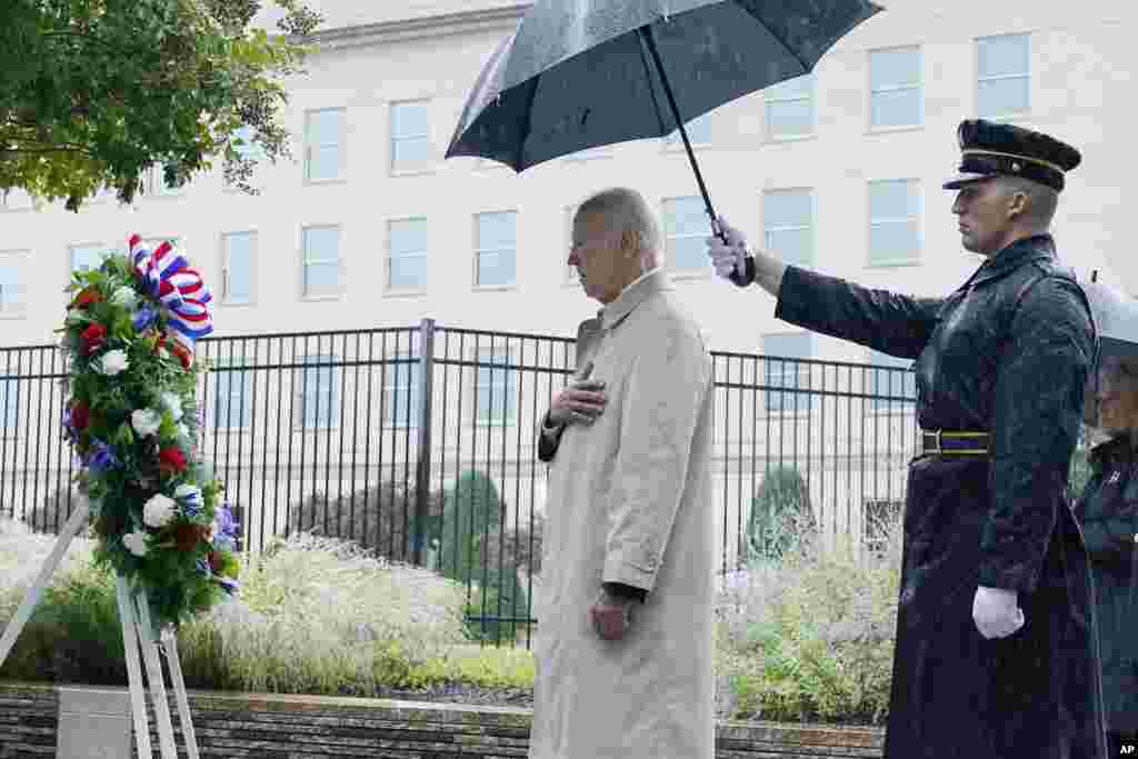 President Joe Biden participates in a wreath laying ceremony while visiting the Pentagon in Washington, Sept. 11, 2022, to honor and remember the victims of the September 11th terror attack. 