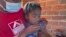 FILE - A child receives a measles vaccination at a clinic in Harare, Zimbabwe, Sept. 6, 2022.
