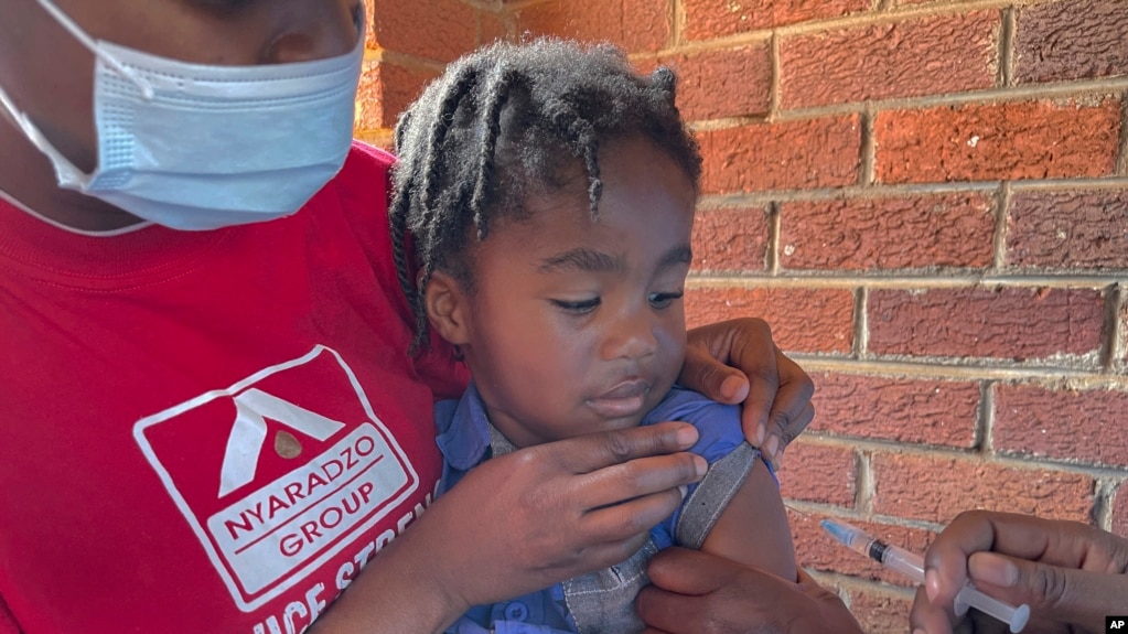 A child receives a measles vaccination jab at a clinic in Harare, Zimbabwe, Sept. 6, 2022.
