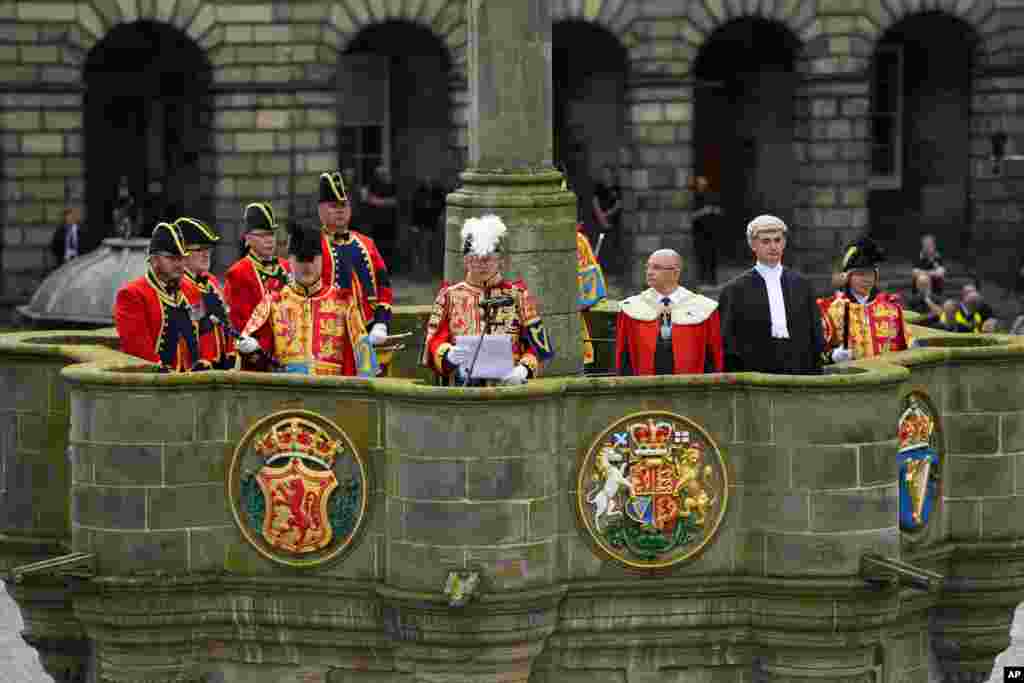 The Lord Lyon King of Arms reads a public Proclamation to the people of Scotland to announce the Accession of King Charles III, outside St Giles Cathedral, on the Royal Mile, in Edinburgh.