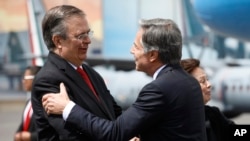 FILE - Mexican Foreign Minister Marcelo Ebrard, left, welcomes US Secretary of State Antony Blinken as Blinken arrives to Benito Juarez International Airport in Mexico City, Sept. 12, 2022. 