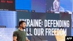 A Handout photograph taken on September 9, 2022 and released on September 10, 2022 by Yalta European Strategy (YES) press office, shows Ukrainian President Volodymyr Zelensky delivering an speech during the Yalta European Strategy forum in Kyiv. (Photo by