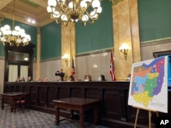 The Ohio Senate Government Oversight Committee hears testimony on a new map of state congressional districts, Nov. 16, 2021, at the Ohio Statehouse in Columbus, Ohio.