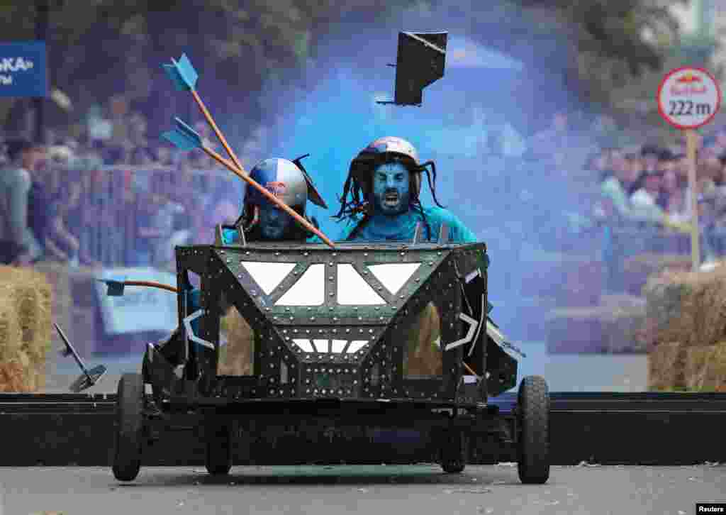 Competitors drive their homemade vehicle without an engine during the Red Bull Soapbox Race in Almaty, Kazakhstan.