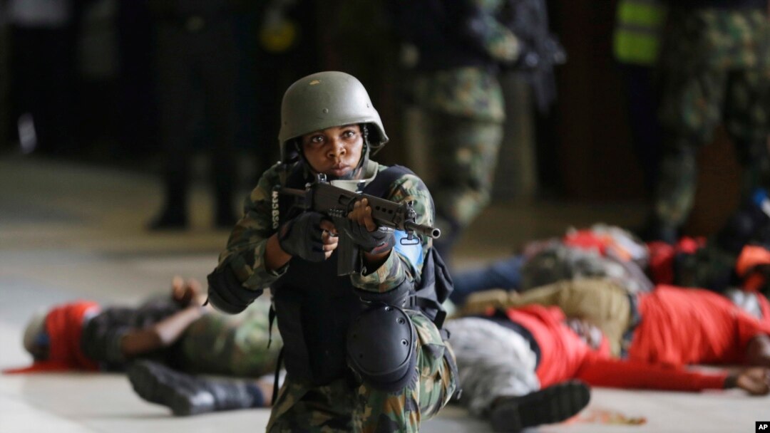 FILE - Nigeria air force special unit simulate during a counter- terrorism exercise, at the Murtala Muhammed International Airport in Lagos, Nigeria, Nov. 8, 2016.