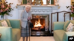 FILE: Britain's Queen Elizabeth II waits in the Drawing Room before receiving Liz Truss for an audience at Balmoral, in Scotland. Taken two days before her death on September 8. 