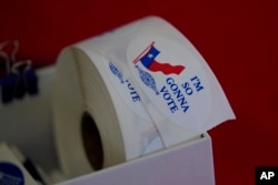 Voting stickers at a political event on Aug. 17, 2022, in Fredericksburg, Texas.