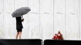 A visitor looks at the Wall of Names before a ceremony commemorating the 21st anniversary of the Sept. 11, 2001 terrorist attacks at the Flight 93 National Memorial in Shanksville, Pennsylvania, Sept. 11, 2022.