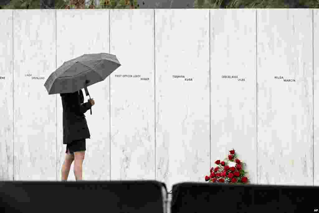 A visitor looks at the Wall of Names before a ceremony commemorating the 21st anniversary of the Sept. 11, 2001 terrorist attacks at the Flight 93 National Memorial in Shanksville, Pennsylvania, Sept. 11, 2022.