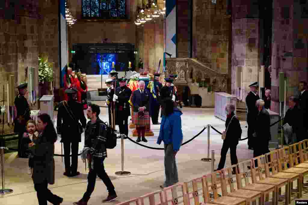 King Charles III and other members of the royal family hold a vigil at St. Giles&#39; Cathedral, Edinburgh, in honor of Queen Elizabeth II as members of the public walk past, Sept. 12, 2022.