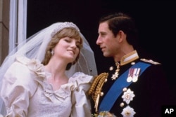 FILE - Britain's Prince Charles and his bride Diana, Princess of Wales, are shown on their wedding day on the balcony of Buckingham Palace in London, July 29, 1981.