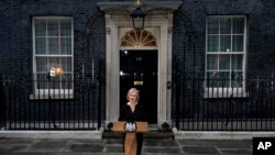 British Prime Minister Liz Truss makes a statement regarding the death of Queen Elizabeth II outside Downing Street in London, Sept. 8, 2022.