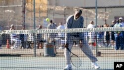 Earl Wilson, an inmate at San Quentin State Prison, hits a return during a tennis match against visiting players in San Quentin, Calif., Aug. 13, 2022.