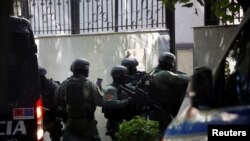 Members of a special police unit enter the Embassy of the Islamic Republic of Iran, as Albania cuts ties with Iran and orders diplomats to leave over a cyberattack, in Tirana, Albania, Sept. 8, 2022.