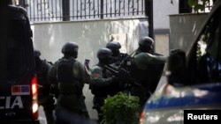 FILE - Members of a special police unit enter the Embassy of the Islamic Republic of Iran, as Albania cuts ties with Iran and orders diplomats to leave over cyberattack, in Tirana, Albania, Sept. 8, 2022.