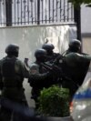 FILE - Members of a special police unit enter the Embassy of the Islamic Republic of Iran, as Albania cuts ties with Iran and orders diplomats to leave over cyberattack, in Tirana, Albania, Sept. 8, 2022.